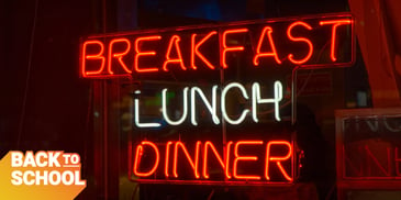 Neon restaurant sign featuring breakfast, lunch, and dinner