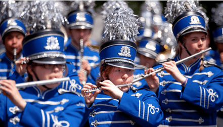 High school marching band performing at an event