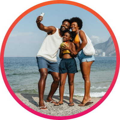 Family taking a photo at the beach