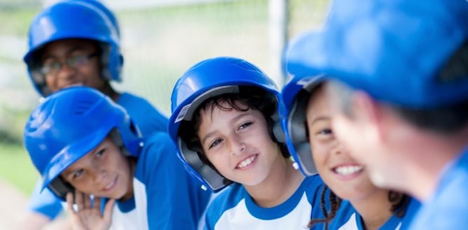 Youth baseball team sitting on the bench