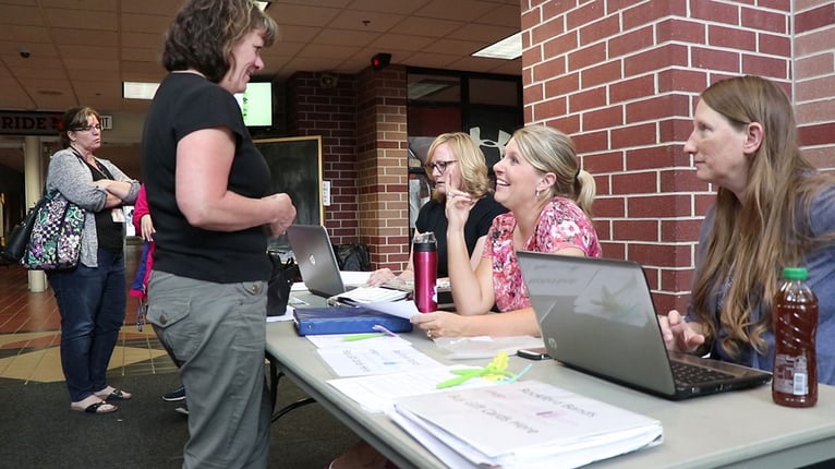 RaiseRight coordinator selling gift cards in person