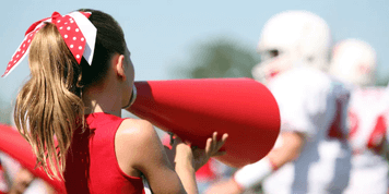 Youth cheerleader with a megaphone