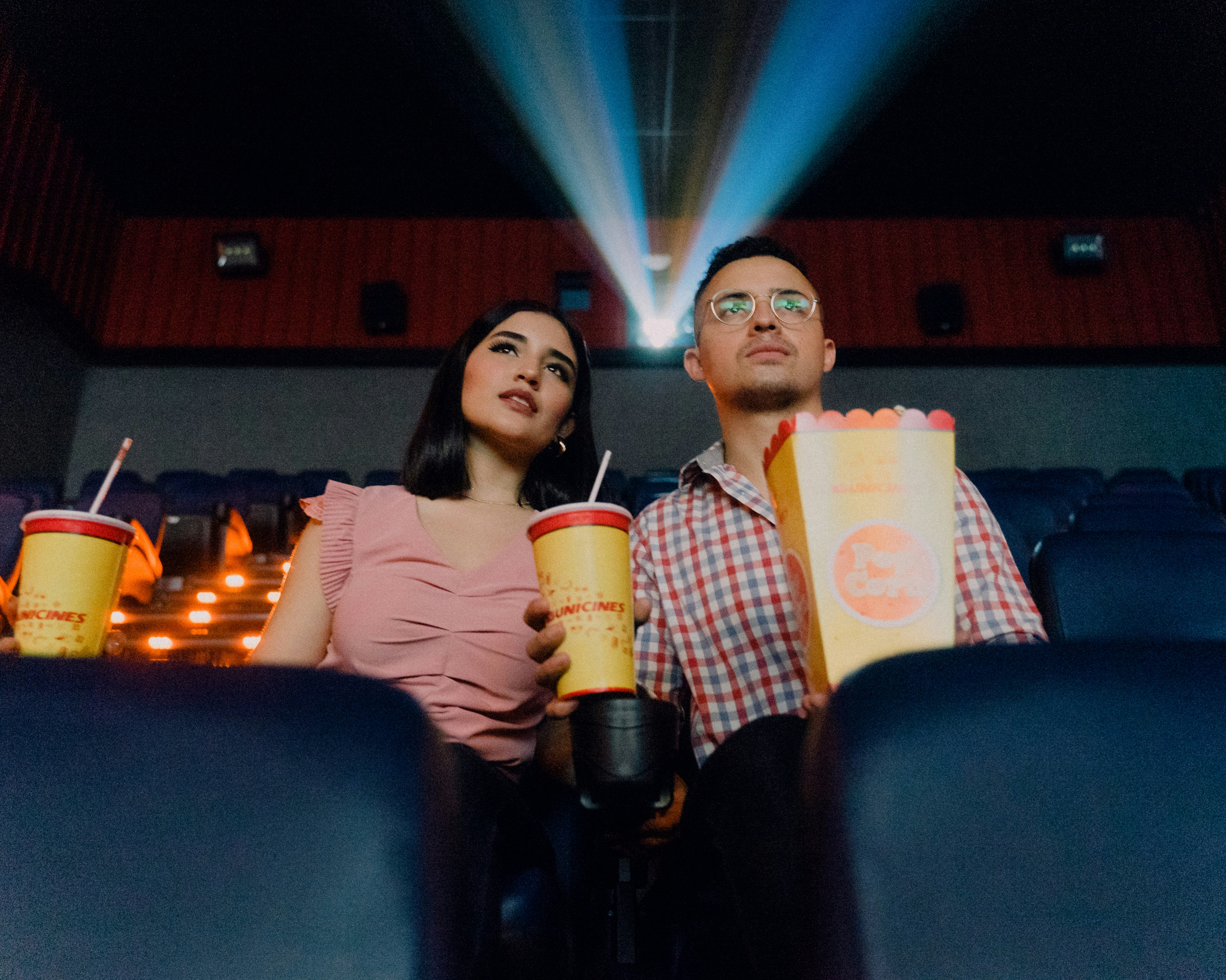 couple enjoying movie night experience at a theater