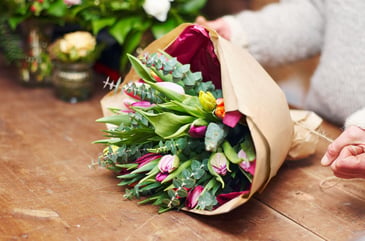 wrapping flowers for a plant sale spring fundraiser
