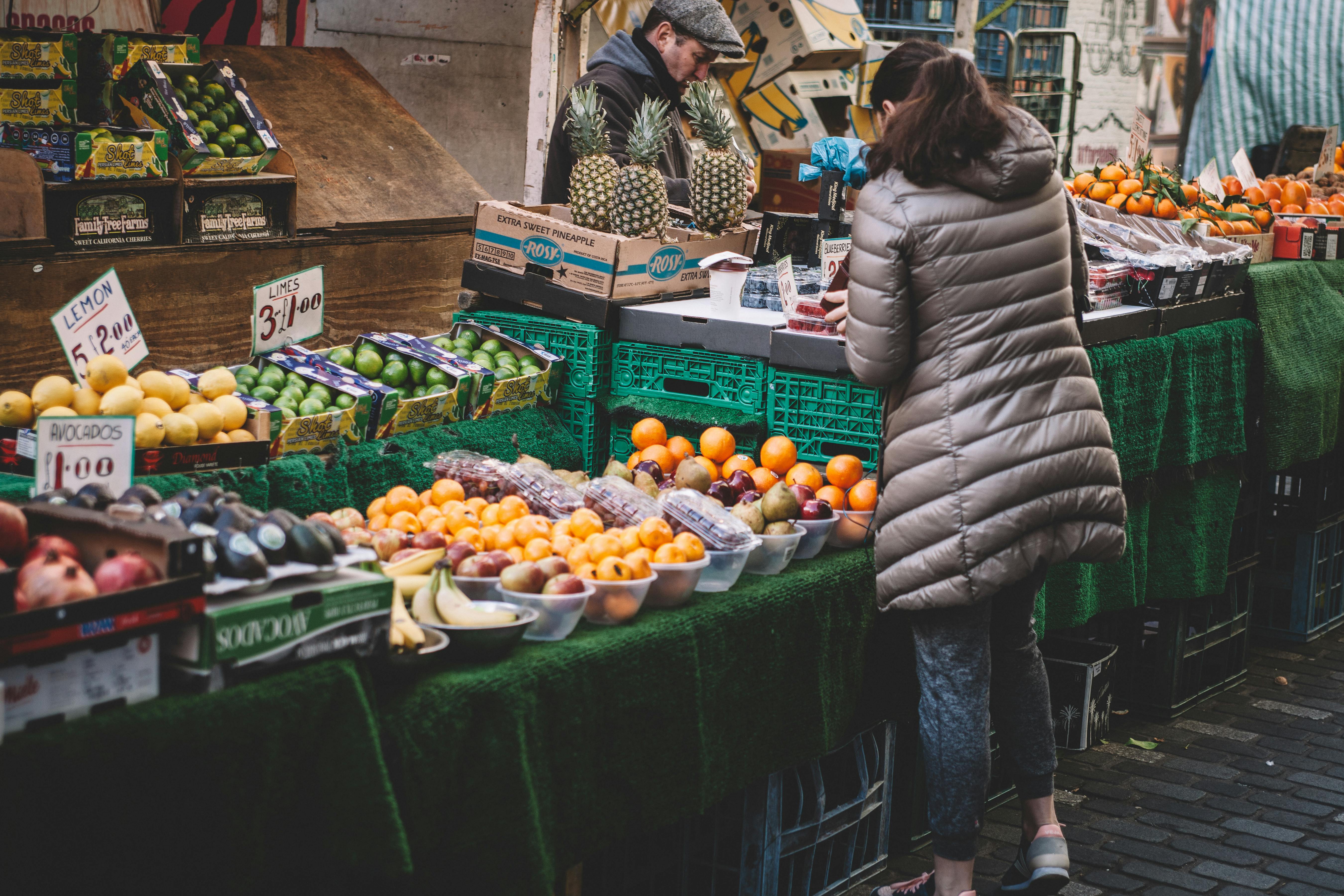 woman shopping at a local farmer's market