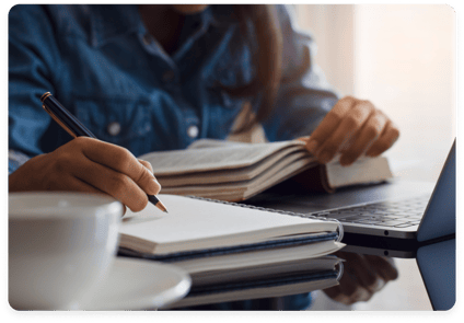 Private school student reading and writing