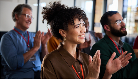 group of people clapping and celebrating