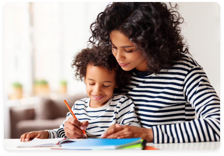 Mother helping young child with homework